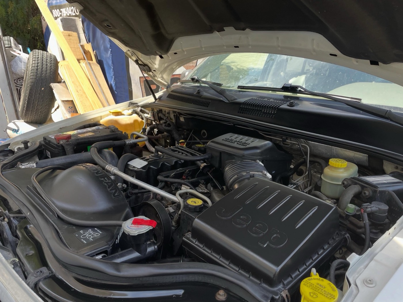 Jeep engine bay after cleaning and a power steering line replacement